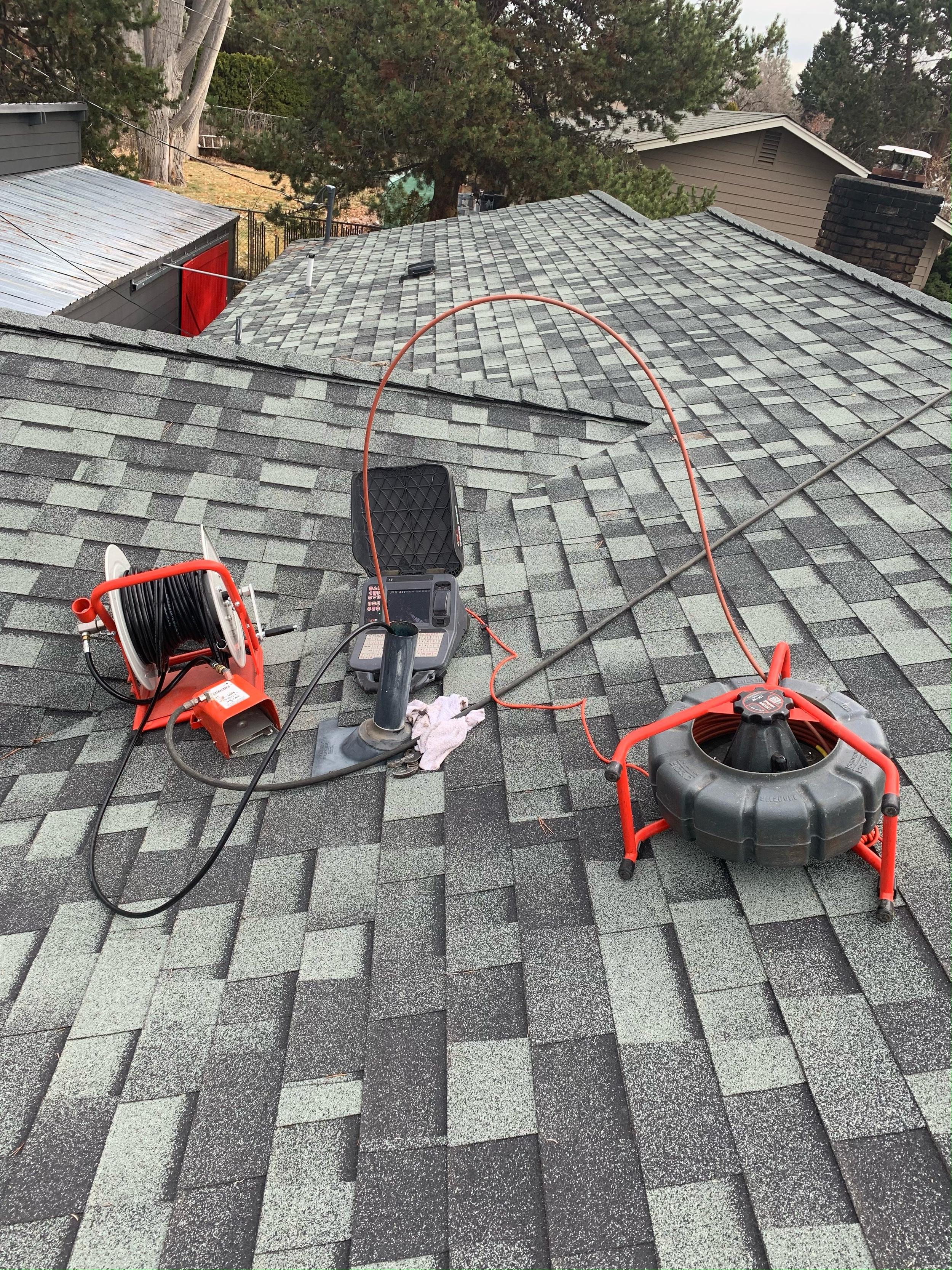 Camera inspection gear sits on a roof in Bend, Oregon.